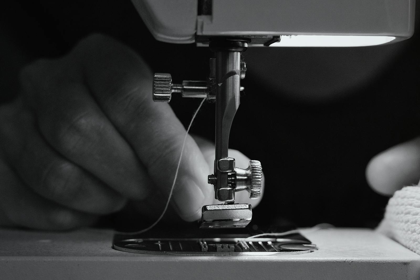 Sewing class with a teacher helping students learn practically